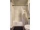 Bathroom with a tub, white subway tile and a decorative shower curtain at 260 18Th Nw St # 10302, Atlanta, GA 30363
