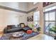 Inviting living room featuring a plush sofa, patterned rug, and a view of the balcony at 260 18Th Nw St # 10302, Atlanta, GA 30363