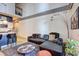 Open-concept living room with a plush sofa, modern decor, and a partial view of the kitchen at 260 18Th Nw St # 10302, Atlanta, GA 30363