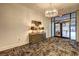 Modern lobby with patterned carpet, console table and unique chandelier lighting at 260 18Th Nw St # 10302, Atlanta, GA 30363