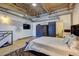 Bright bedroom with exposed ductwork, a TV, and a sliding door to the ensuite bathroom at 260 18Th Nw St # 10302, Atlanta, GA 30363