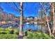 Picturesque pond with a fountain, bridge and skyline views, framed by trees at 260 18Th Nw St # 10302, Atlanta, GA 30363
