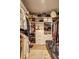Organized walk-in closet with ample storage, shelving, and drawers for clothes at 260 18Th Nw St # 10302, Atlanta, GA 30363