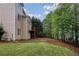 Expansive backyard featuring a spacious lawn and complemented by mature trees at 3637 Green Pine Way, Suwanee, GA 30024