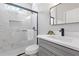 Bathroom includes new finishes with a glass door shower and gray vanity at 3637 Green Pine Way, Suwanee, GA 30024