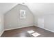 Bedroom with a vaulted ceiling, hardwood floors, a window, and a closet door at 3637 Green Pine Way, Suwanee, GA 30024