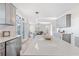 Modern eat-in kitchen offers great flow to the living room for easy entertaining at 3637 Green Pine Way, Suwanee, GA 30024