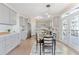 Bright eat-in kitchen boasts gray cabinets, stainless appliances, and access to the outdoor deck at 3637 Green Pine Way, Suwanee, GA 30024