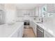 This modern kitchen offers gray cabinets, stainless appliances, and white countertops at 3637 Green Pine Way, Suwanee, GA 30024