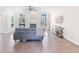 Inviting living room featuring a fireplace, hardwood floors, and plenty of natural light at 3637 Green Pine Way, Suwanee, GA 30024