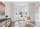 Cozy living room area showcasing a bay window, stylish chair, and hardwood floors at 3637 Green Pine Way, Suwanee, GA 30024