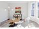 Inviting living room featuring hardwood floors, large windows and stylish furnishings at 3637 Green Pine Way, Suwanee, GA 30024