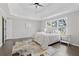 This primary bedroom features a trey ceiling, neutral decor, and a view of the outdoors at 3637 Green Pine Way, Suwanee, GA 30024