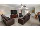 Cozy living room with plush seating, a ceiling fan, and access to another room through French doors at 4101 Spring Meadow Rd, Tucker, GA 30084