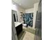 Bathroom featuring a vanity with dark wood cabinets and a decorative shower curtain at 5215 Tye Trl, Fairburn, GA 30213