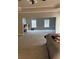 Spacious bedroom with tray ceiling and carpet floors at 5215 Tye Trl, Fairburn, GA 30213