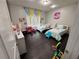 Bright bedroom with hardwood floors, charming decor, and plenty of space for  at 5215 Tye Trl, Fairburn, GA 30213