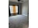 Bedroom featuring carpeted floors, a window, and ample natural light at 5215 Tye Trl, Fairburn, GA 30213