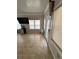 Cozy game room with tiled floors, mini fridge, and television at 5215 Tye Trl, Fairburn, GA 30213