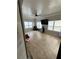 This game room features tiled floors, a television, and ample natural light at 5215 Tye Trl, Fairburn, GA 30213