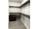 Custom walk-in closet with shelves and clothing racks for optimal storage at 5215 Tye Trl, Fairburn, GA 30213