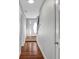 View of a hallway with hardwood floors and access to other rooms in the house at 5660 Garden Cir, Douglasville, GA 30135