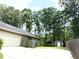 This property features a storage shed, lots of trees, and a sprawling backyard at 1312 La Mesa Dr, Lawrenceville, GA 30043