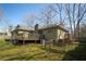 Wide view of home's backyard, deck area, and fenced-in yard at 1312 La Mesa Dr, Lawrenceville, GA 30043