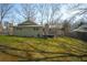 Expansive backyard with a well-maintained lawn and a charming green home at 1312 La Mesa Dr, Lawrenceville, GA 30043