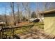 Deck with backyard view showcasing the lush lawn and wooded area at 1312 La Mesa Dr, Lawrenceville, GA 30043