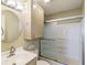 Inviting bathroom showcasing an enclosed shower, stylish vanity with an elegant mirror, and bright lighting at 1312 La Mesa Dr, Lawrenceville, GA 30043