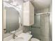 Updated bathroom with a modern vanity, beautiful mirror, a fully enclosed shower, and bright lighting at 1312 La Mesa Dr, Lawrenceville, GA 30043