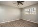 Bright, airy bedroom with wood-look flooring and a large window overlooking the yard at 1312 La Mesa Dr, Lawrenceville, GA 30043