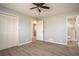 Spacious bedroom with closet, en-suite bathroom, wood-look flooring, and neutral wall color, offering a blank canvas at 1312 La Mesa Dr, Lawrenceville, GA 30043