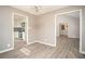 Open-concept dining area with access to the kitchen featuring white cabinets and stainless appliances at 1312 La Mesa Dr, Lawrenceville, GA 30043