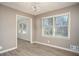 Bright dining area showcases wood-look flooring, modern lighting, and neutral wall paint at 1312 La Mesa Dr, Lawrenceville, GA 30043