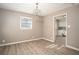 Dining area with chandelier lighting, wood floors, and doorway to the kitchen at 1312 La Mesa Dr, Lawrenceville, GA 30043