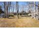 Charming single-story home with an inviting front yard surrounded by mature trees and a well-maintained lawn at 1312 La Mesa Dr, Lawrenceville, GA 30043