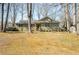 Charming single-story home with an inviting front yard surrounded by mature trees and a well-maintained lawn at 1312 La Mesa Dr, Lawrenceville, GA 30043