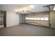 Well-kept garage showcasing an automatic overhead door, and a neatly painted floor, maximizing its functionality at 1312 La Mesa Dr, Lawrenceville, GA 30043