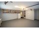 Spacious garage featuring built-in shelves for storage, a well-lit door, and ample open area for convenience at 1312 La Mesa Dr, Lawrenceville, GA 30043