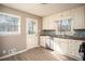 Cozy kitchen featuring updated cabinets, stainless appliances, and natural light at 1312 La Mesa Dr, Lawrenceville, GA 30043