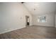 Bright living room featuring laminate floors, high ceilings, and lots of natural light at 1312 La Mesa Dr, Lawrenceville, GA 30043