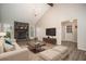 Stylishly staged living room with vaulted ceilings, fireplace, and wood laminate flooring at 1312 La Mesa Dr, Lawrenceville, GA 30043