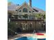 Picture of the deck and pool area with multiple windows and door to the home's interior at 1470 Sweet Bottom Sw Cir, Marietta, GA 30064