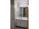 Bathroom featuring a white vanity with drawers and cabinets and a framed mirror at 1470 Sweet Bottom Sw Cir, Marietta, GA 30064