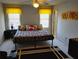 Bedroom featuring a comfortable bed, ceiling fan, and two windows with valances at 1470 Sweet Bottom Sw Cir, Marietta, GA 30064