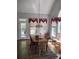 Dining area with ample natural light from large windows and a view of the backyard at 1470 Sweet Bottom Sw Cir, Marietta, GA 30064
