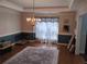 Dining room with a chandelier, area rug, large window with curtains, and chair railing at 1470 Sweet Bottom Sw Cir, Marietta, GA 30064