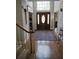 Inviting foyer with a striking front door, high ceiling, and elegant hardwood floors at 1470 Sweet Bottom Sw Cir, Marietta, GA 30064